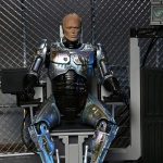 RoboCop: Battle Damaged RoboCop with Chair - Ultimate Actionfigur - 18 cm